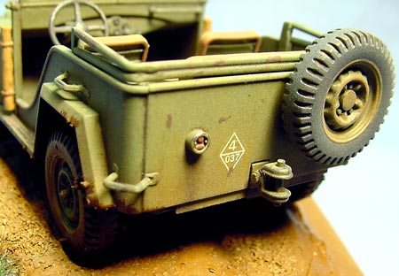 [I sprayed thinned Tamiya Desert Yellow along the bottom edges of the model for a faded and dusty look.]